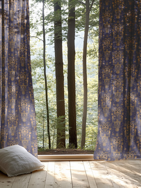 A sheer curtain panel featuring a repeating pattern of ornate golden owls surrounded by delicate floral designs and botanical elements on a deep navy background. The fabric has a fine linen-like texture with translucent qualities.